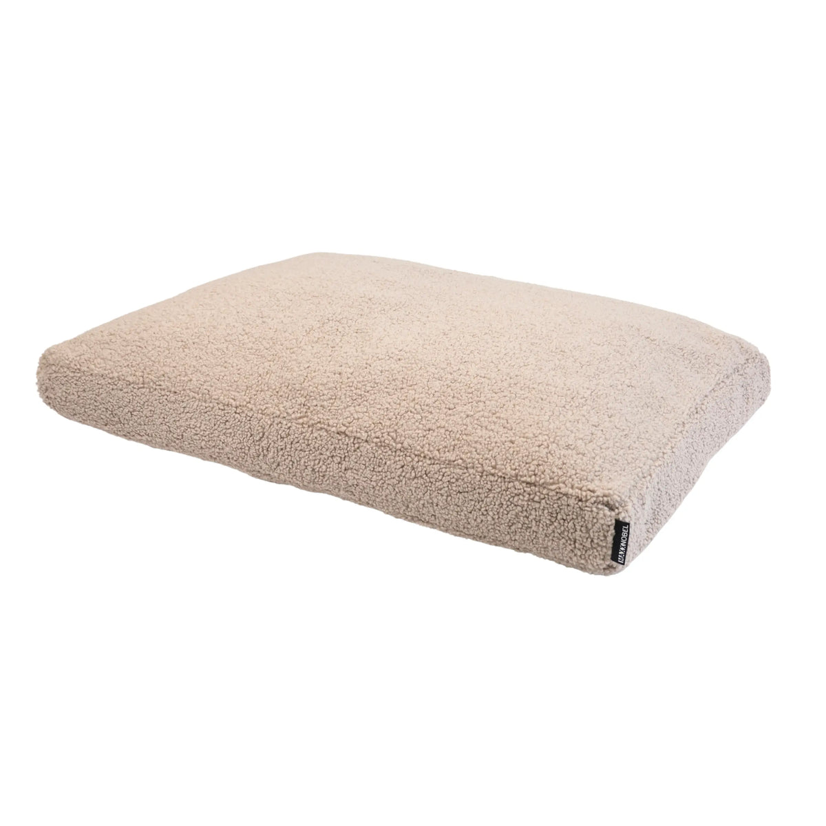Beige orthopedisch hondenkussen teddy van pluche schapenvacht met zachte, getextureerde oppervlakte en subtiel merklabel